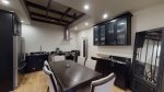 Large dining and kitchen area with high ceilings